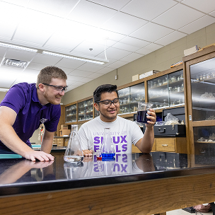 two students in chemistry class